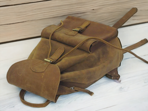Crafted from full grain high quality genuine leather, this back bag combines durability and style. Perfect for the fashion-forward individual, it offers the highest quality material for a sleek and professional look. Stay organized and add luxury to your daily commute with this stylish bag.