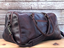Load image into Gallery viewer, This premium sports duffle bag is made of full grain high quality genuine leather, ensuring durability and style. With its spacious interior and multiple compartments, it offers convenient storage for all your sports equipment. Perfect for athletes and fitness enthusiasts, this bag combines practicality with luxury.