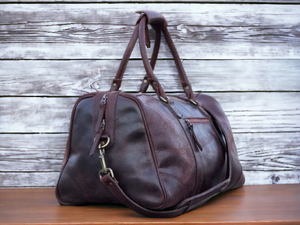 This premium sports duffle bag is made of full grain high quality genuine leather, ensuring durability and style. With its spacious interior and multiple compartments, it offers convenient storage for all your sports equipment. Perfect for athletes and fitness enthusiasts, this bag combines practicality with luxury.
