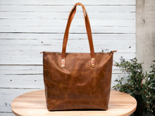 Load image into Gallery viewer, Expertly crafted with high quality and genuine leather, this tote bag is the perfect accessory for stylish and sophisticated women. The durable and luxurious material ensures long-lasting use while the spacious design allows for easy organization of all your essentials. Elevate your wardrobe with this elegant tote bag.