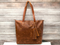 Expertly crafted with high quality and genuine leather, this tote bag is the perfect accessory for stylish and sophisticated women. The durable and luxurious material ensures long-lasting use while the spacious design allows for easy organization of all your essentials. Elevate your wardrobe with this elegant tote bag.