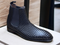 Expertly crafted and stylish, these black woven leather Chelsea boots are the perfect addition to any man's wardrobe. With a sleek and fashionable design, these boots will elevate any outfit while providing comfort and durability. Perfect for any dressy occasion, these handmade boots are a must-have for the modern man.